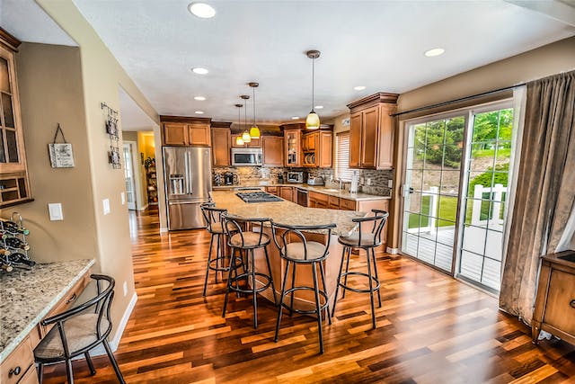 A photo of pendant lights hanging over a kitchen island