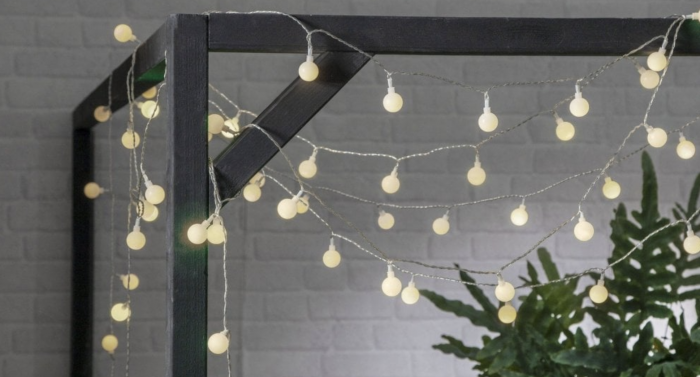 Festoon lighting loosely hung across a pergola