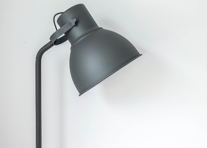 Grey desk lamp positioned sideways