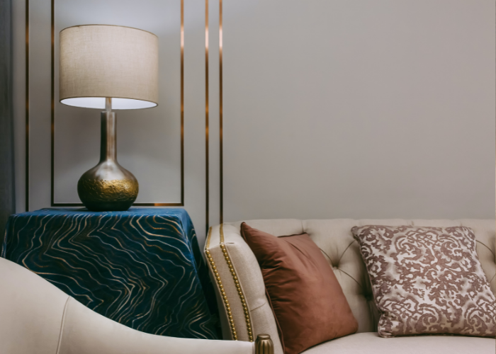 Leather sofa and a table lamp positioned to the left of it