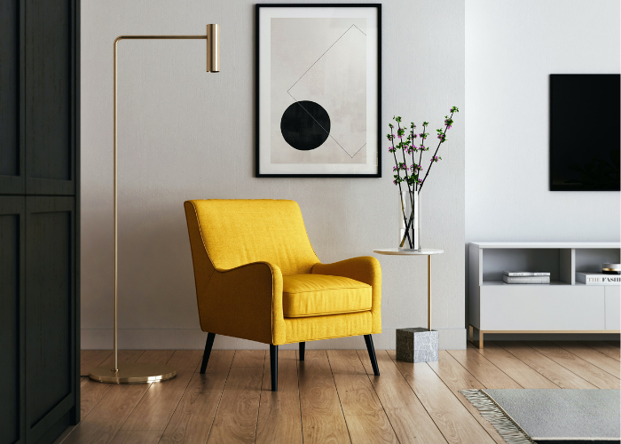 contemporary front room with a yellow chair placed next to a tall gold floor lamp